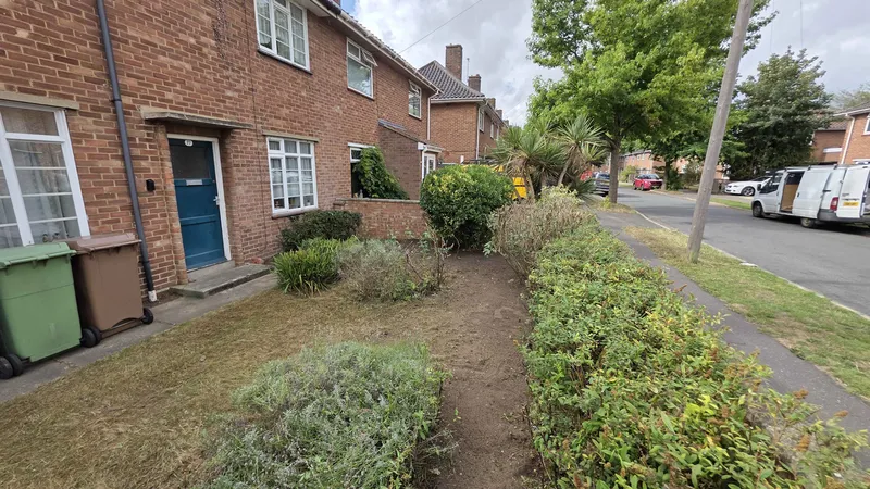 Tidy front garden with trimmed shrubs and clear access after GreenRun work